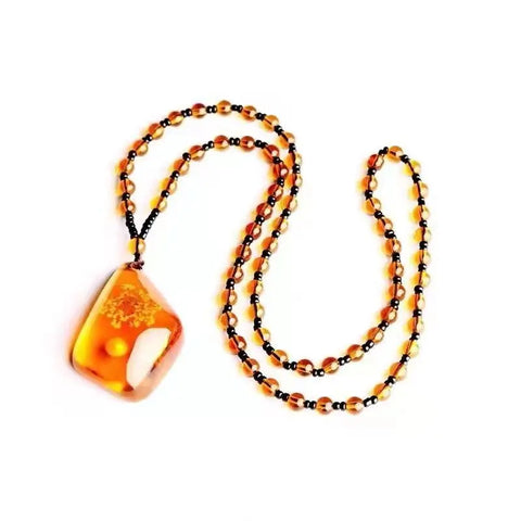 Chinese Beeswax Necklace With Ornament Inside the Pendant