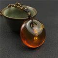 Chinese Beeswax Necklace With Ornament Inside the Pendant - EveryWares