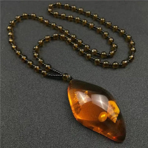 Chinese Beeswax Necklace With Ornament Inside the Pendant - EveryWares